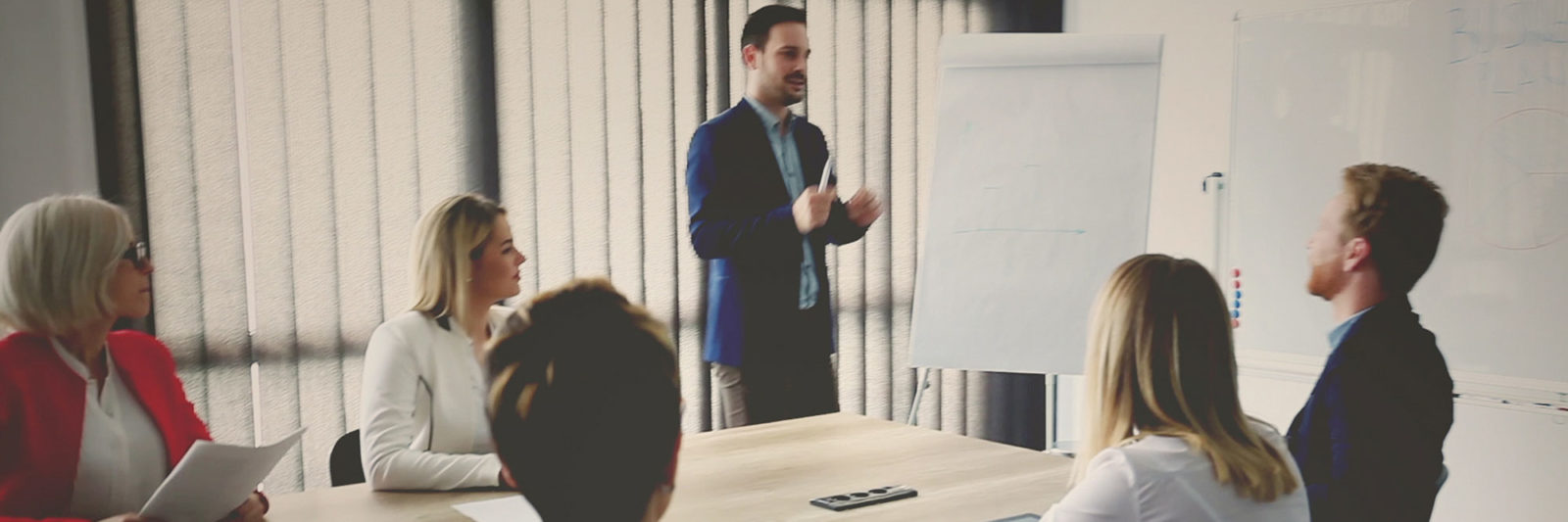 man-giving-presentation-to-colleagues-meeting-room-iSpeak